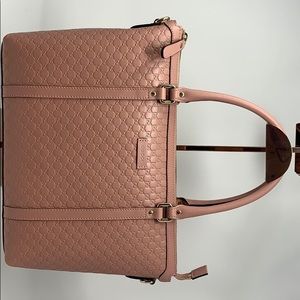 Gucci pink leather convertible purse.